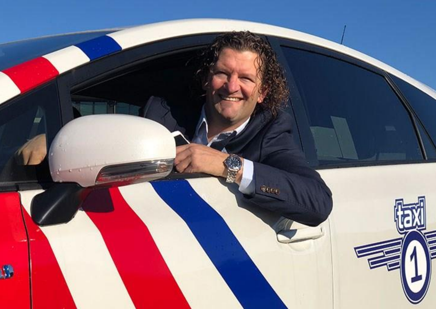 Robert Aasmul, daglig leder i Taxi 1, i en Taxi 1-bil
